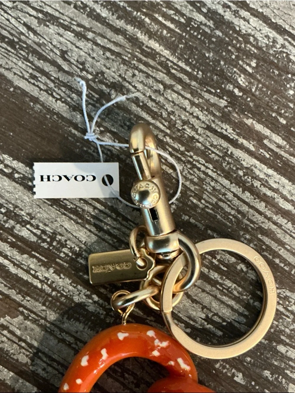 Coach Orange Pretzel Charm Keyring/Bag charm with Gold Hardware. Dusty Included